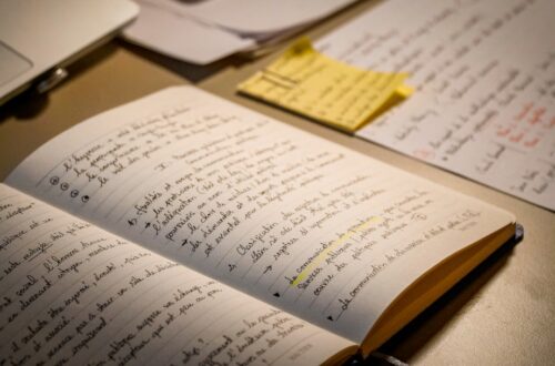 An open notebook filled with handwritten text.